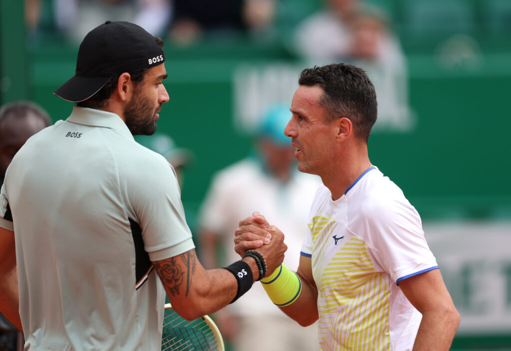 Matteo Berrettini shakes hands with Roberto Bautista Agut at the 2026 Monte Carlo Masters.