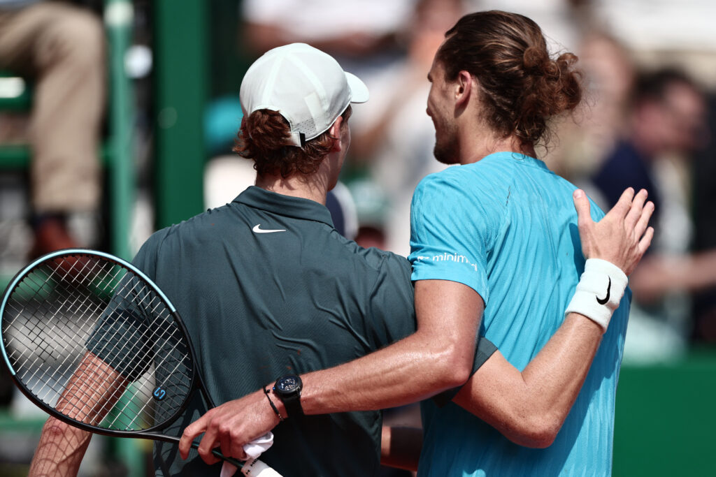 Jannik Sinner and Alexander Zverev embrace.