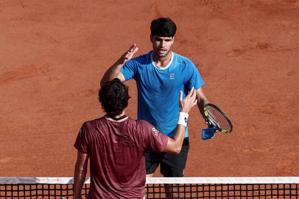 Valentin Vacherot shakes hands with Carlos Alcaraz after losing to him at the 2026 Monte Carlo Masters.