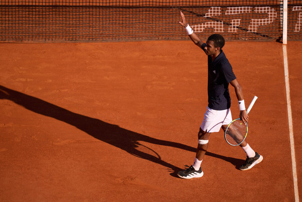 Felix Auger-Aliassime waves to the crowd at the Monte-Carlo Masters.