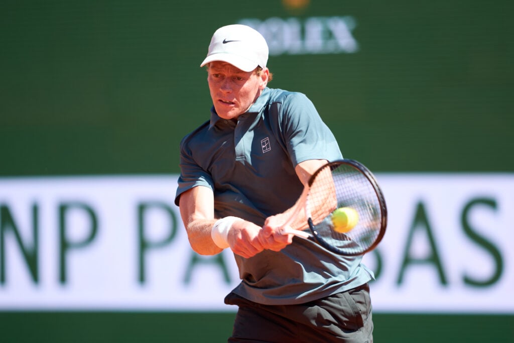 Jannik Sinner hits a backhand against Tomas Machac at the 2026 Monte Carlo Masters.