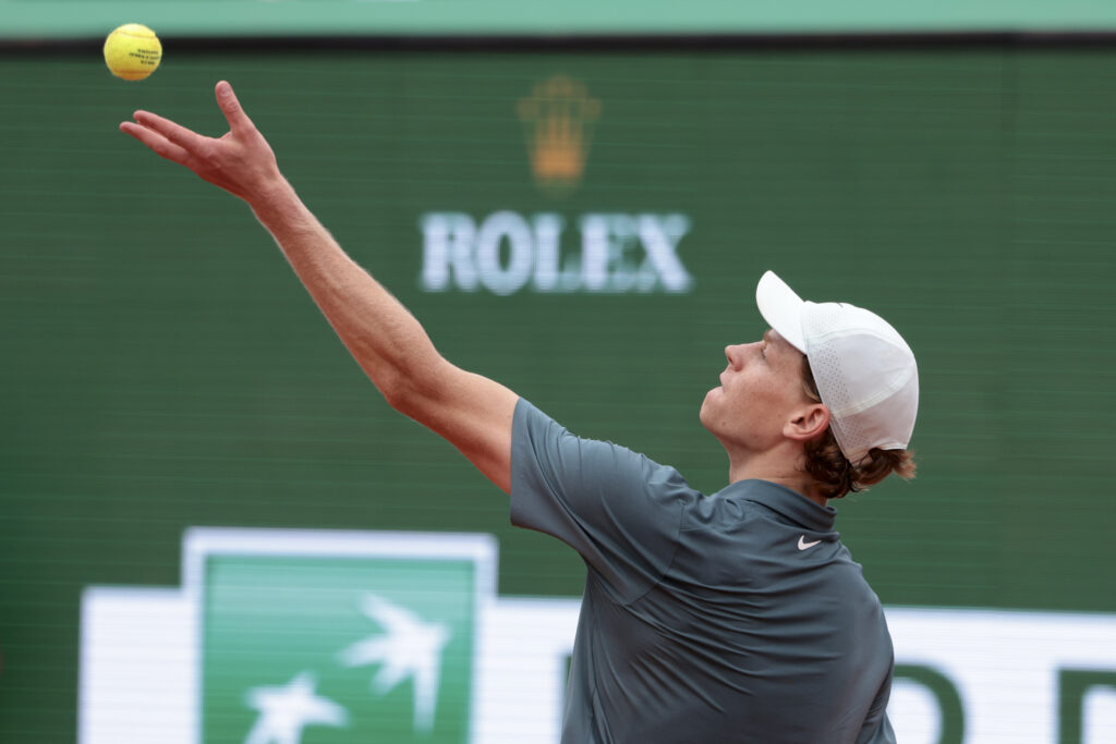 Jannik Sinner hits a serve against Carlos Alcaraz in the 2026 Monte Carlo Masters final.