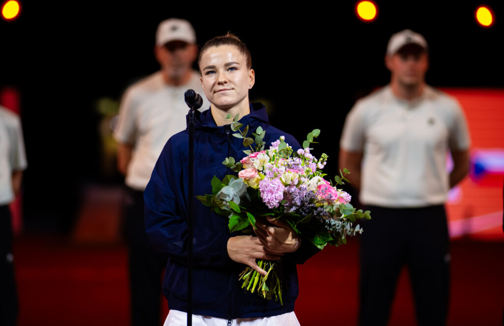 Karolina Muchova speaking in the post-match ceremony after losing to Elena Rybakina in the 2026 Porsche Tennis Grand Prix final in Stuttgart.