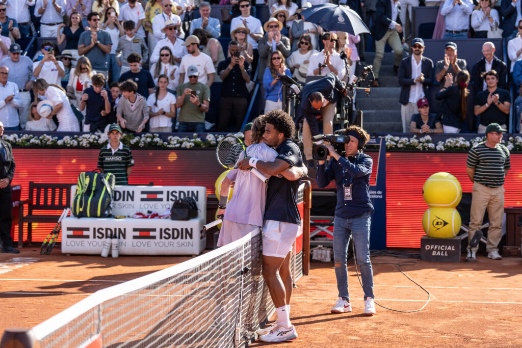 Arthur Fils and Andrey Rublev embrace.