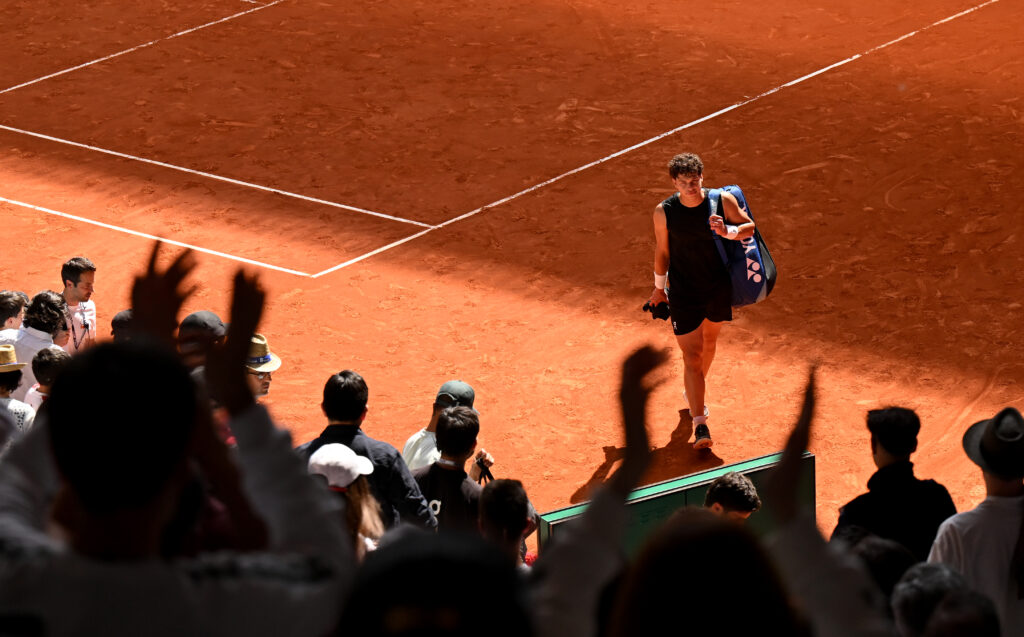 Ben Shelton walks off the court in Madrid.