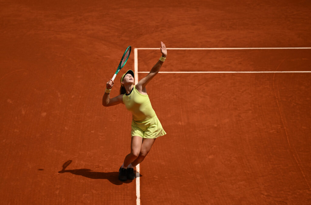 Mirra Andreeva serves at the Madrid Open.