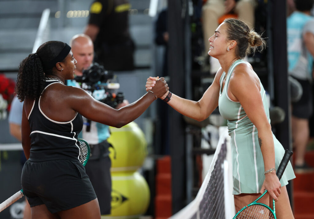 Hailey Baptiste and Aryna Sabalenka shake hands at the 2026 Madrid Open