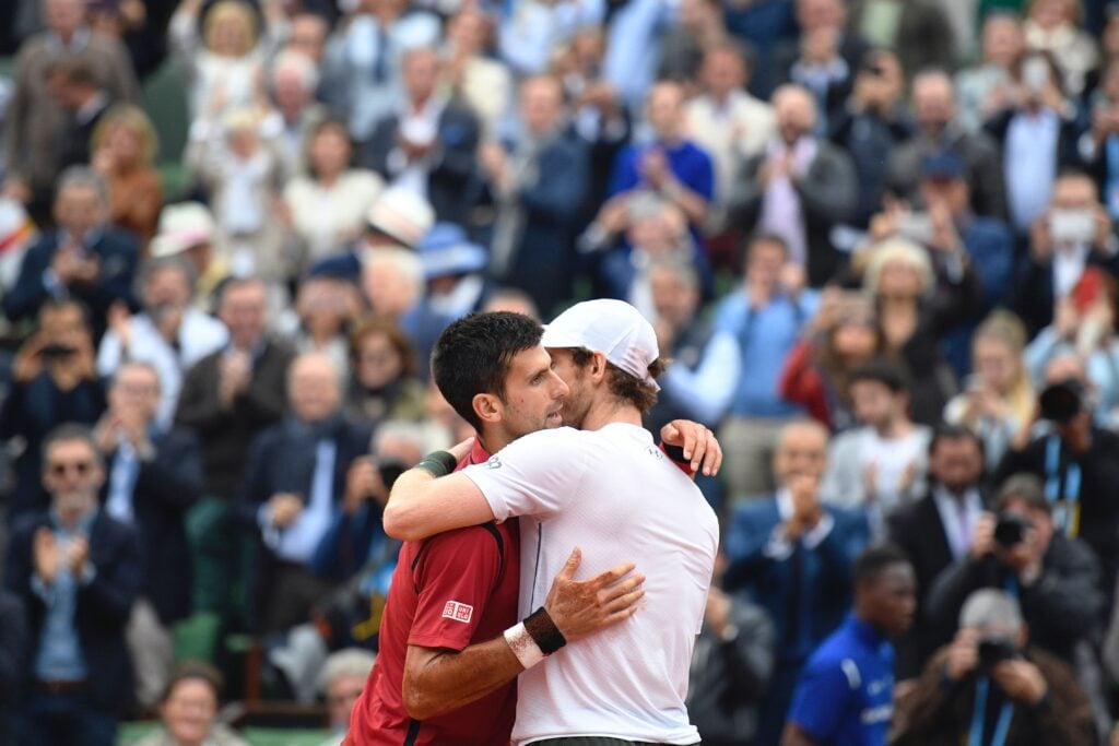 Novak Djokovic and Andy Murray embrace at Roland Garros.