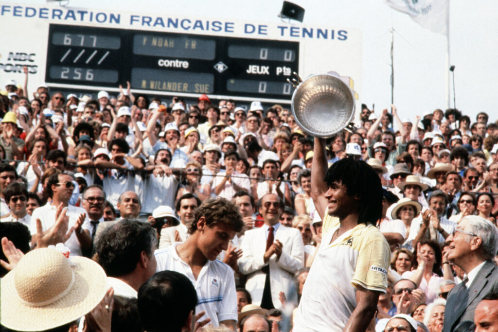 Yannick Noah holds the French Open trophy aloft in 1983.