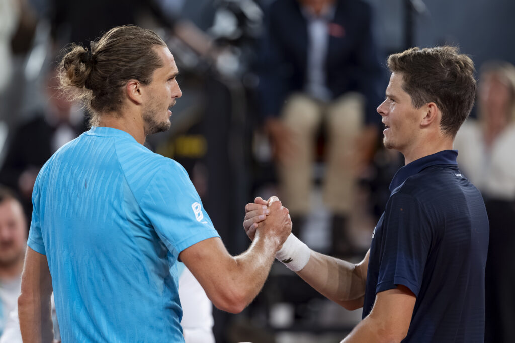 Alexander Zverev and Alexander Blockx shake hands.