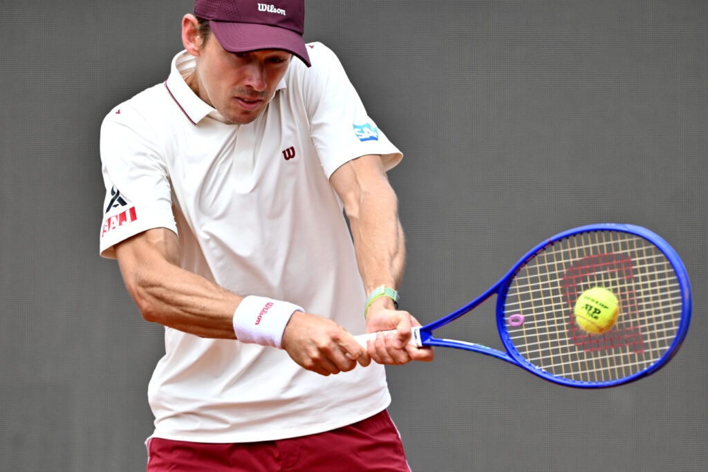 Alex de Minaur hits a backhand at the 2026 Italian Open.