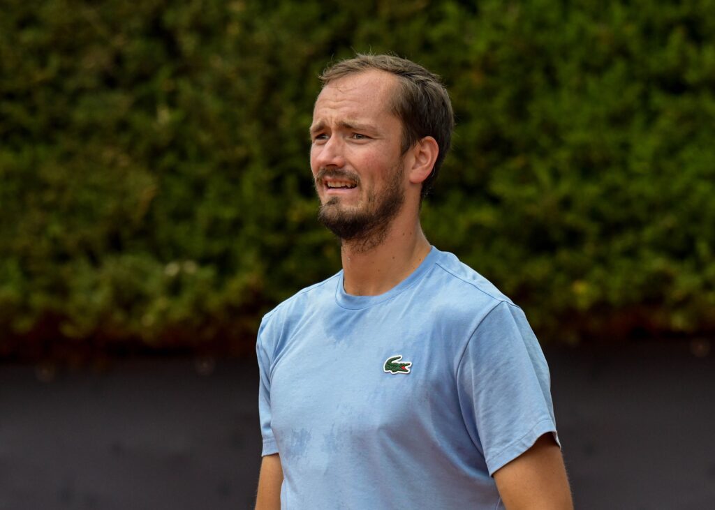 Daniil Medvedev looks on.