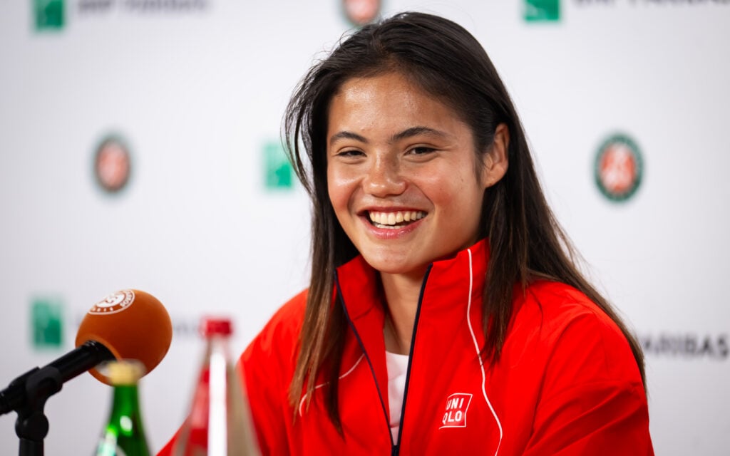 Emma Raducanu smiles at a press conference.