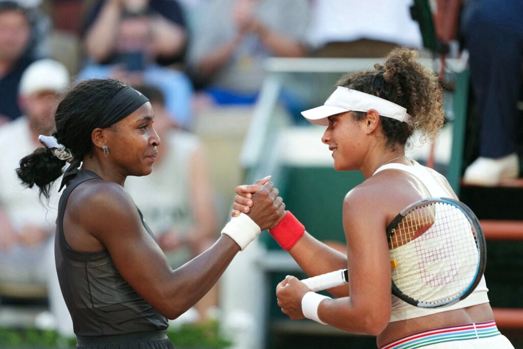Coco Gauff and Mayar Sherif shake hands.