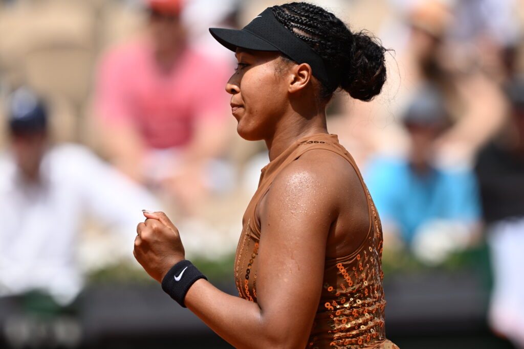 Naomi Osaka pumps her fist at Roland Garros.