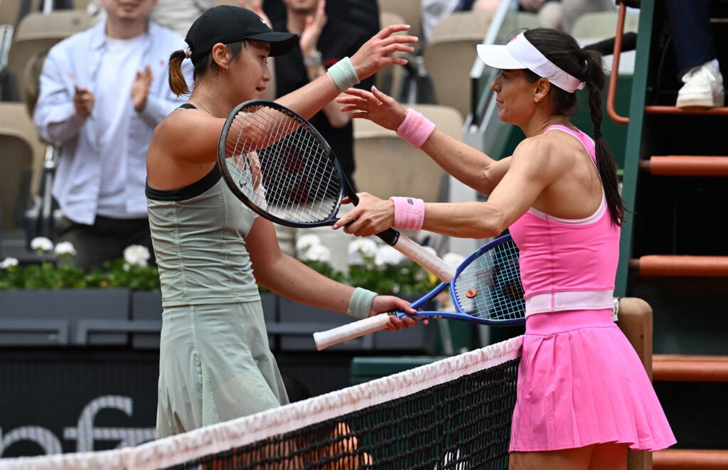 Sorana Cirstea and Xiyu Wang embrace at the French Open.
