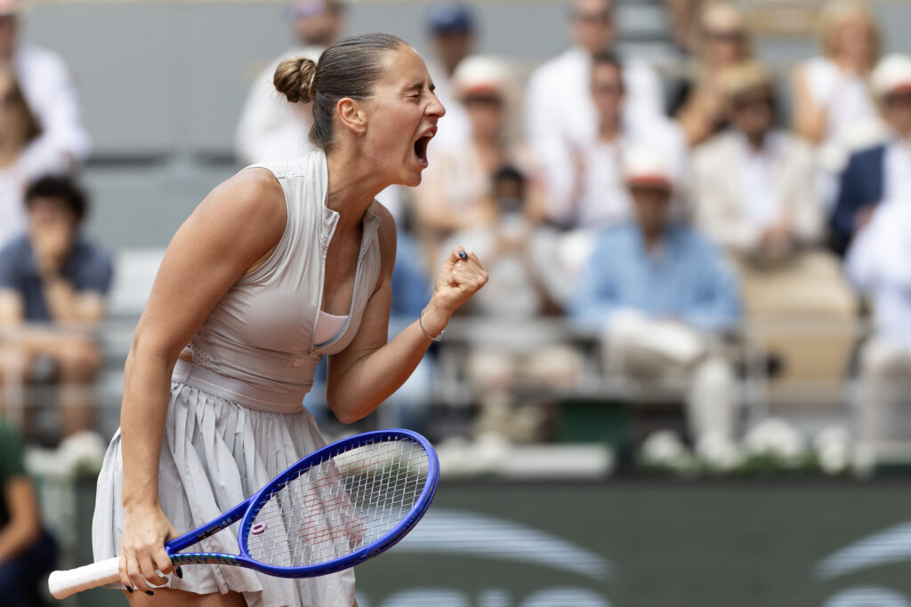Marta Kostyuk celebrates at Roland Garros.