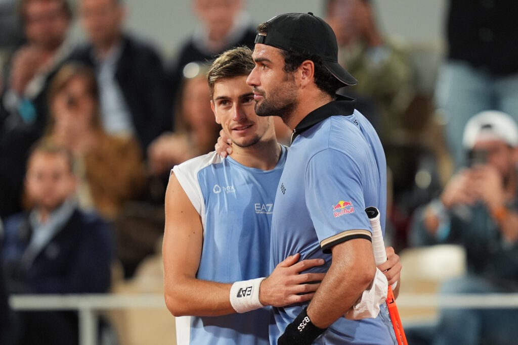 Matteo Arnaldi and Matteo Berrettini embrace.