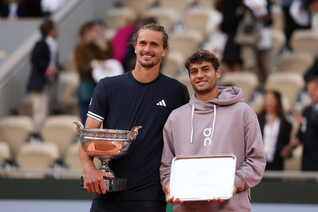 Alexander Zverev and Flavio Cobolli pose with their trophies after the 2026 French Open final.