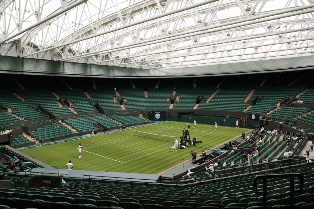 Novak Djokovic and Jannik Sinner practice ahead of Wimbledon.