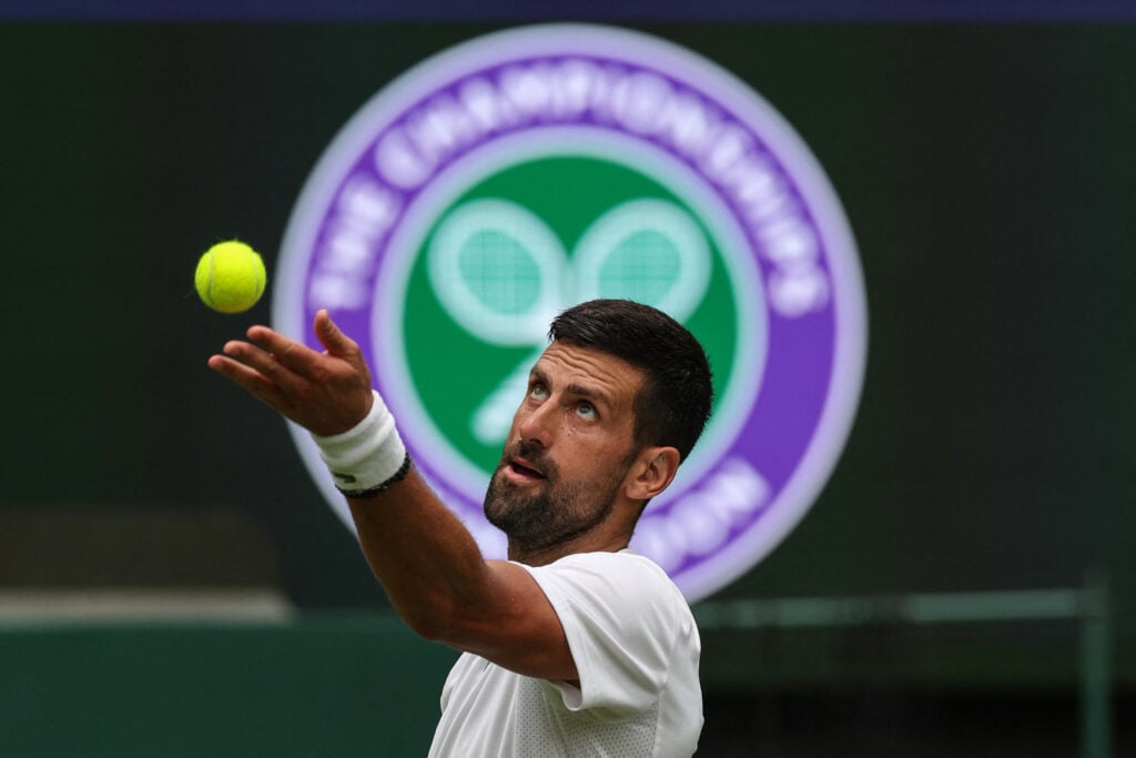 Novak Djokovic serves in practice at Wimbledon.