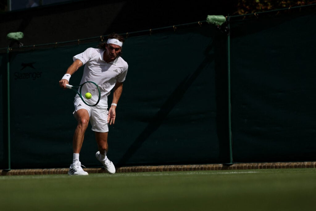 Stefanos Tsitsipas in action at Wimbledon in 2026.
