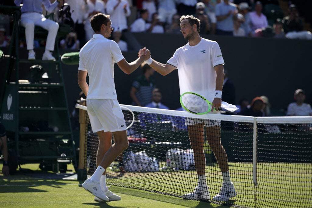 Daniil Medvedev and Jan-Lennard Struff shake hands.