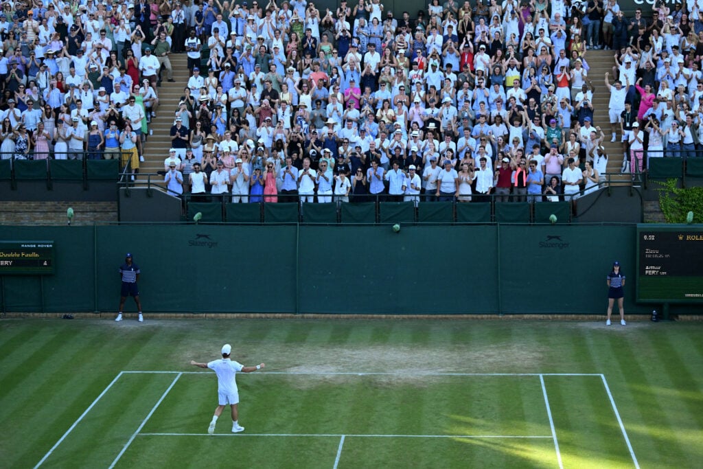 Arthur Fery celebrates with the Wimbledon crowd after reaching the fourth round.