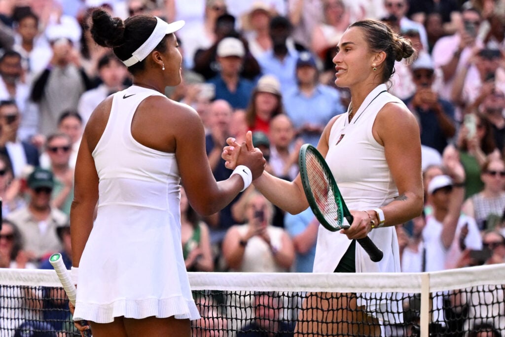 Naomi Osaka and Aryna Sabalenka shake hands at Wimbledon.