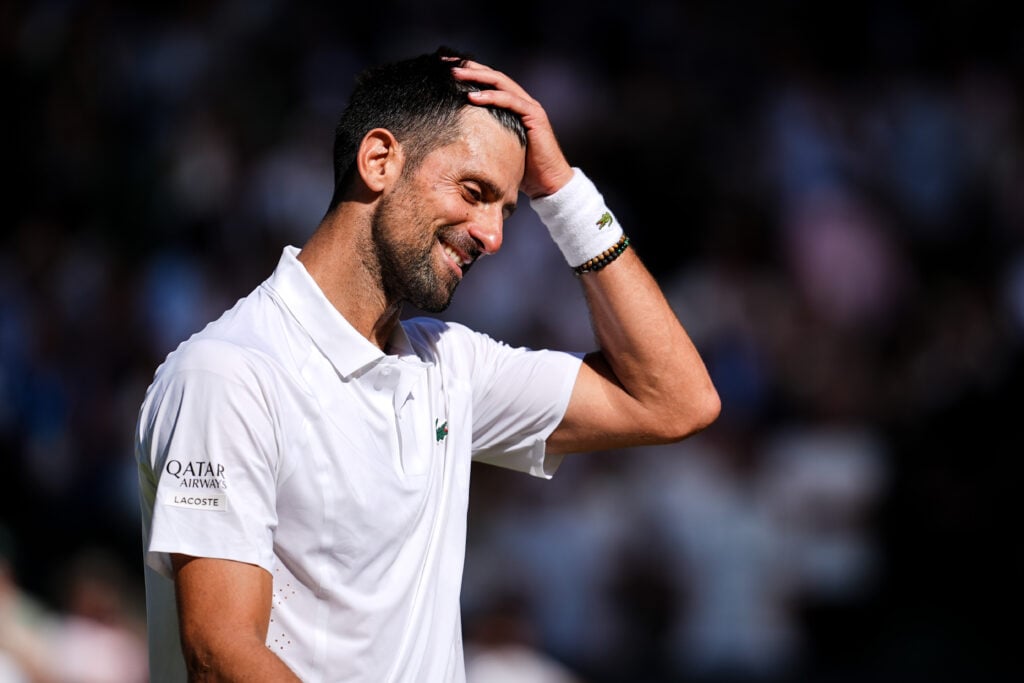 Novak Djokovic smiles at Wimbledon in 2026.