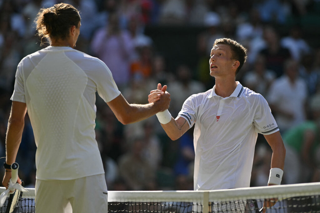 Alexander Zverev and Jiri Lehecka shake hands.