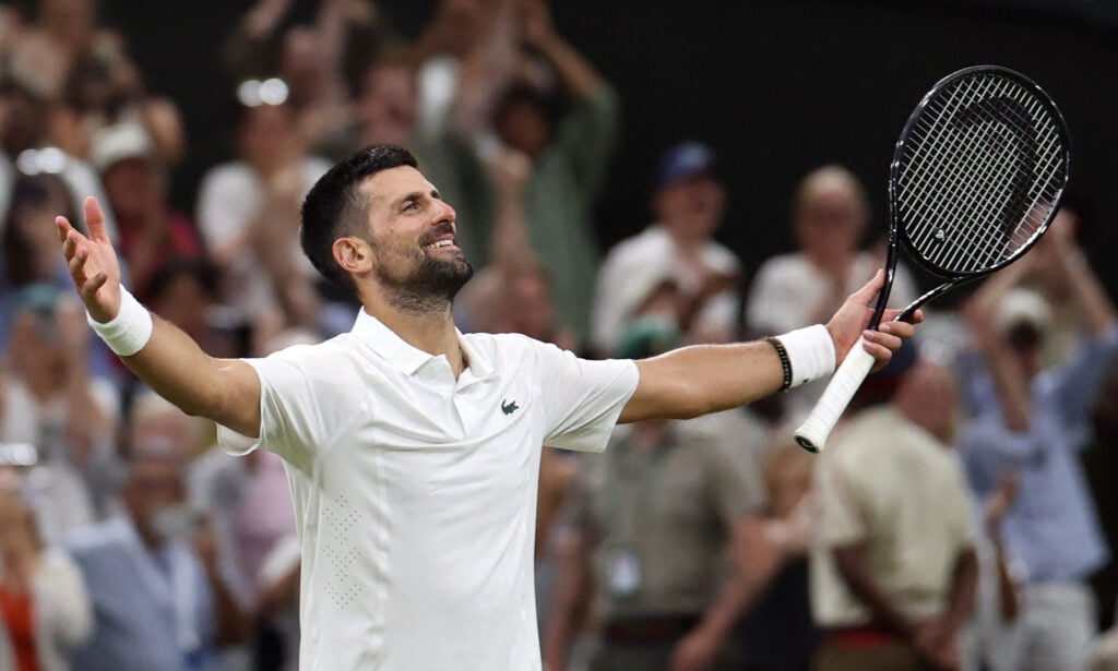 Novak Djokovic celebrates after reaching the semifinals at Wimbledon.