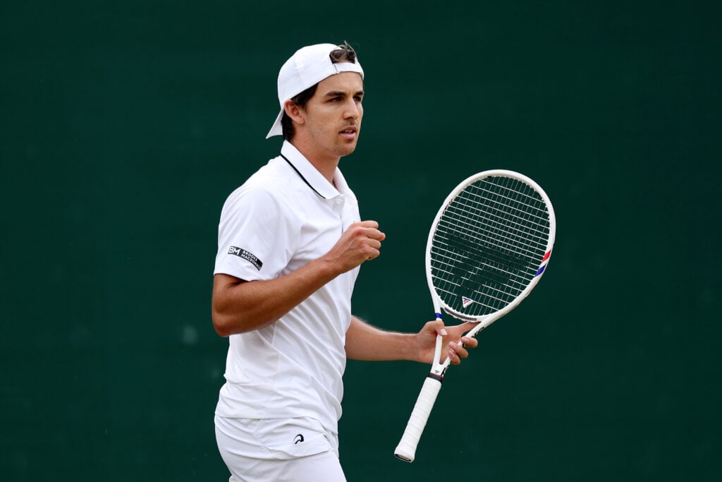 Zachary Svajda celebrates a point at Wimbledon.