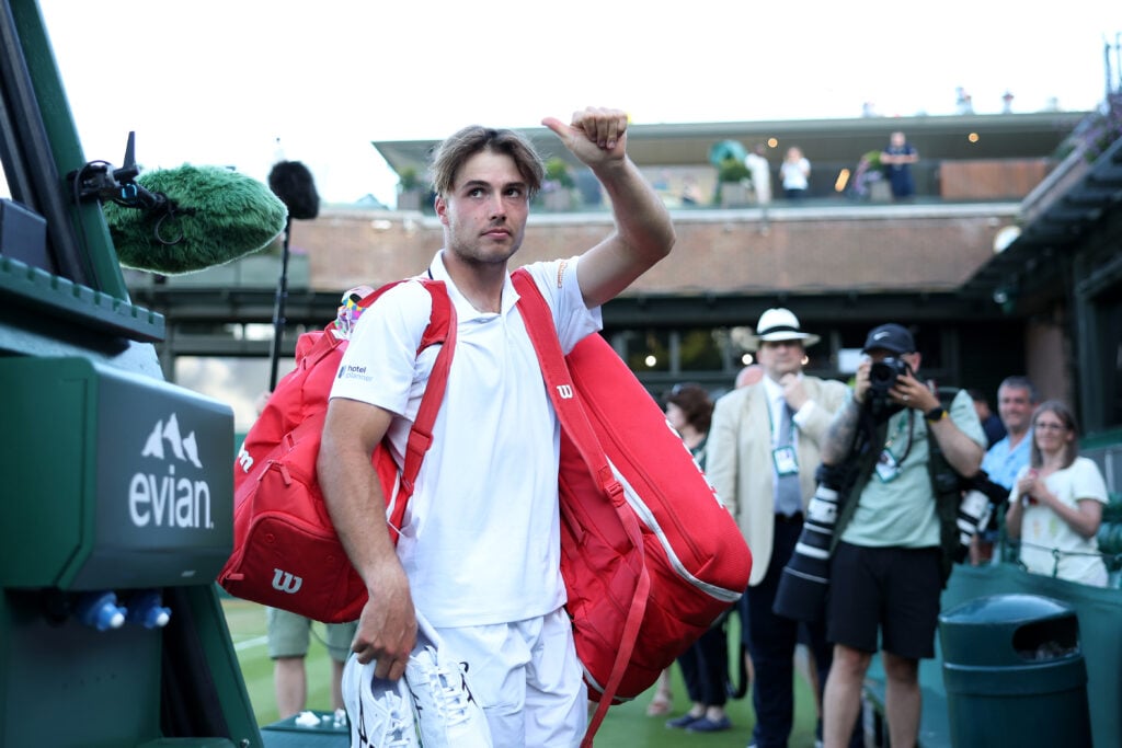 Arthur Fery acknowledges the crowd at Wimbledon.