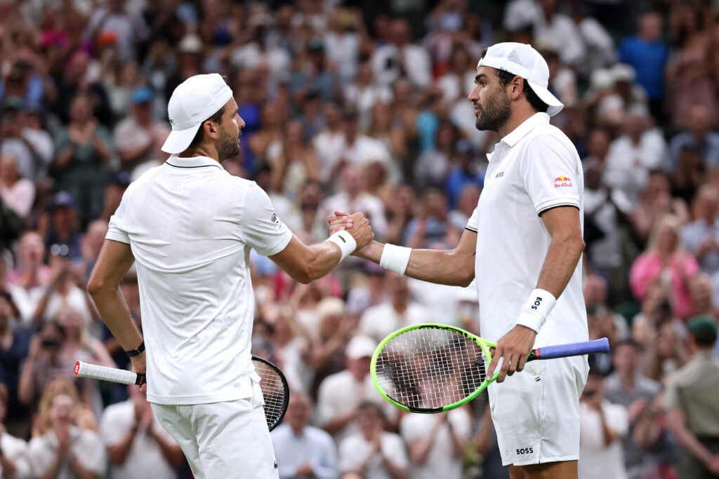 Matteo Berrettini and Grigor Dimitrov shake hands at Wimbledon.