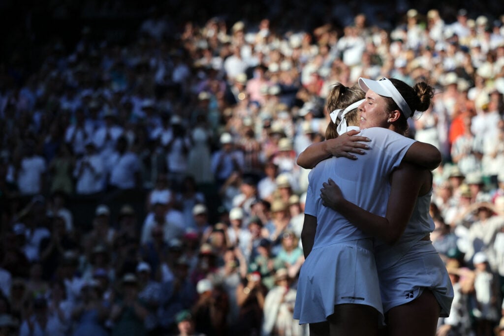 Linda Noskova and Karolina Muchova embrace.