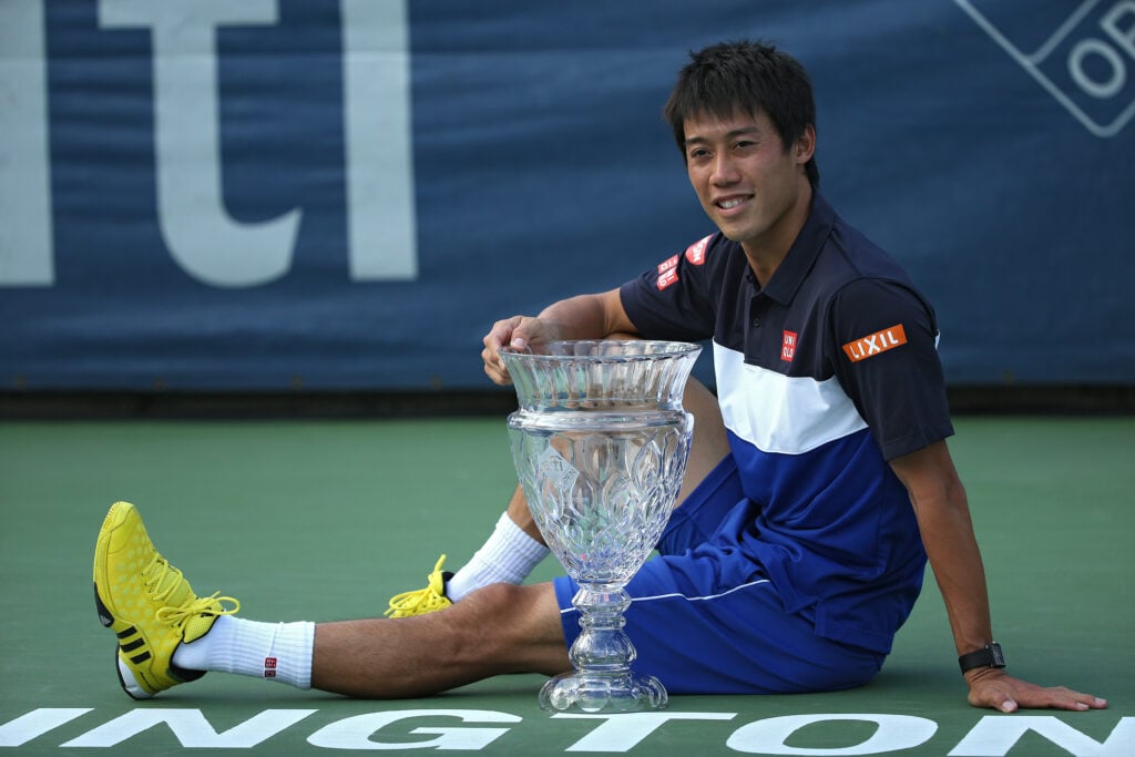 Kei Nishikori poses with the Washington Open title in 2015.